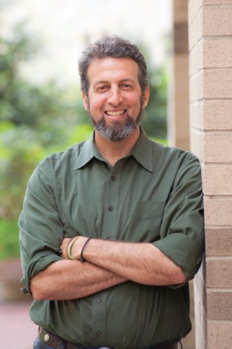 Florida: Dan Kahn (headshot), executive director of Florida Restorative Justice Association, smiling man with short gray curly hair, beard, khaki shirt with rolled-up sleeves, bracelets
