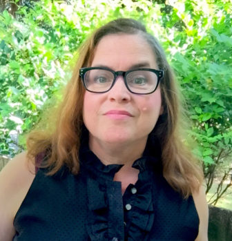 Florida: Deborrah Brodsky (headshot), director of the Project on Accountable Justice, woman with shoulder-length light brown hair, black glasses, navy blue sleeveless top 