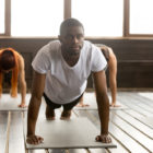 HOPE Court: young black man in yoga class standing in plank pose
