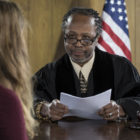 plea bargaining: Female attorney addressing an African American judge in court