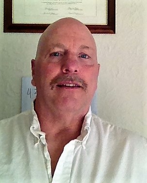 gun violence: David Keck (headshot), project director of National Resource Center on Domestic Violence and Firearms, bald man with mustache wearing white shirt 