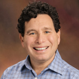 hospital: Joel Fein (headshot), co-director of Violence Prevention Initiative at Children's Hospital of Philadelphia, smiling man with short brown curly hair, checked blue and gray shirt