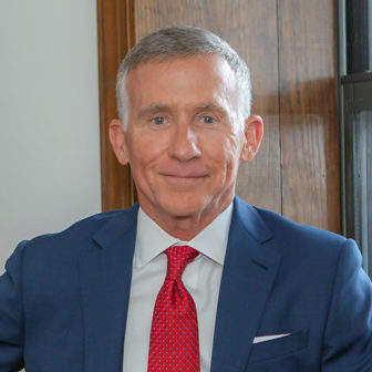 Jacksonville: Kevin Gay (headshot), CEO and founder of Operation New Hope, smiling man with short gray hair, bright blue suit, red tie, light blue shirt.