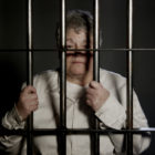 drugs: Elderly woman in Dark Prison behind bars