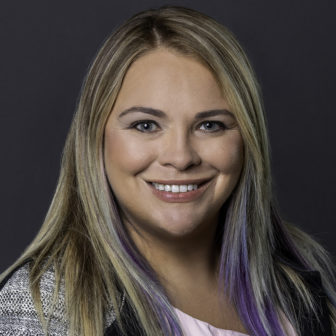Malvo: Meghan Bishop (headshot), associate fellow for innovation, technology for Joseph Rainey Center for Public Policy, smiling woman with blond, lilac hair wearing necklace, black and white blazer, pink top