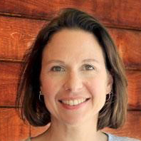 probation officers: Johanna Lacoe (headshot), research director of California Policy Lab, smiling woman with short brown hair and earrings, gray top