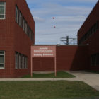 Connecticut: Outside of brick building with sign saying Juvenile Detention Center Building Entrance