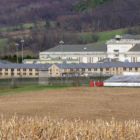 Pennsylvania: Complex of buildings seen across field