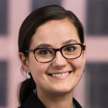 probation officers: Leah Sakala (headshot), senior policy associate at Urban Institute Justice Policy Center, smiling woman with black ponytail, glasses, earrings, black jacket, blue top