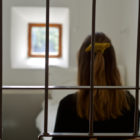 juvenile justice staff: a young woman in a prison cell