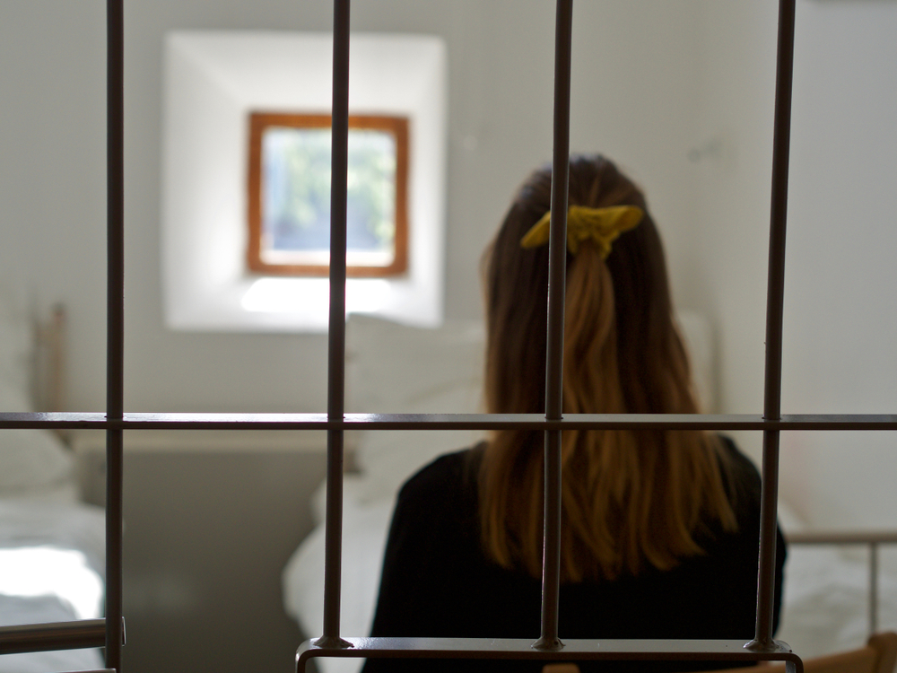 juvenile justice staff: a young woman in a prison cell