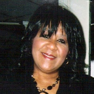 ost: Jennifer Bonner (headshot), president of Michigan Afterschool Association, smiling woman with black hair, wearing black necklace, black jacket