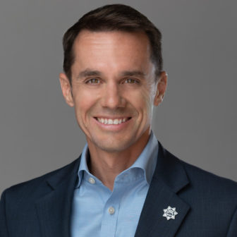 California: Brian Richart (headshot), president of Chief Probation Officers of California, smiling man with short dark hair, dark jacket with 7-pointed star on lapel, light blue shirt