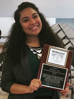 probation officers: Miracle Te'o (headshot), National Youth Advisory Council member for Annie E. Casey Foundation, smiling woman with long dark hair, dark green outfit, holding up award plaque.