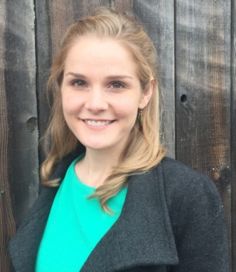 California: Maureen Washburn (headshot), on policy, communications team at Center on Juvenile and Criminal Justice, smiling blonde woman with green top, gray coat.