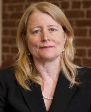 Diane Smith Howard (headshot), managing attorney for criminal and juvenile justice, National Disability Rights Network, woman with blonde hair, earrings, necklace, black jacket