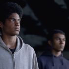 equity: 2 depressed black young men looking to the right