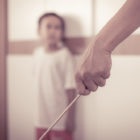 resentencing: The father holds the wand and is hitting the son with it, vintage color tone