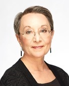 self-care: Patricia K. Kerig (headshot), professor of clinical psychology at University of Utah, woman with short gray hair, glasses, earrings, dressed in black