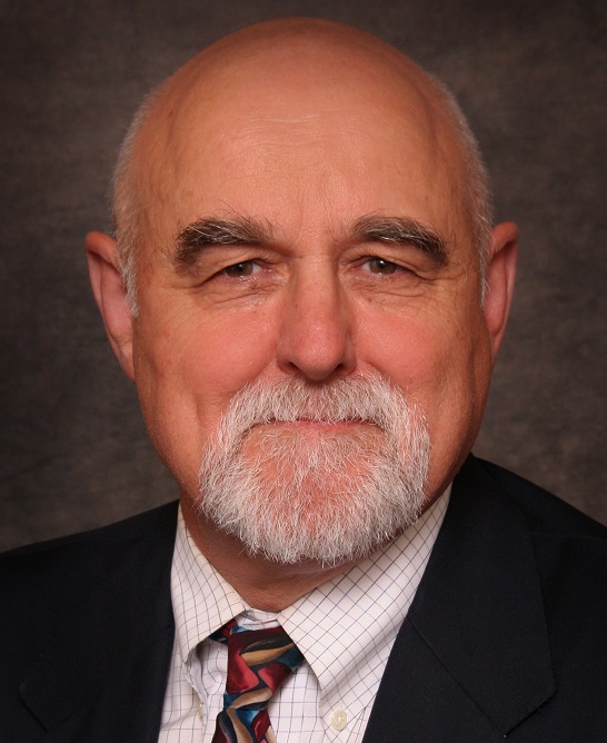 assault-style rifle: Stephen Hargarten (headshot), emergency physician, injury prevention and control scientist, balding man with gray mustache, beard, black jacket, checked shirt, patterned tie 