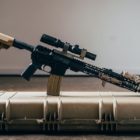 assault-style rifle: assault-style rifle sitting on case