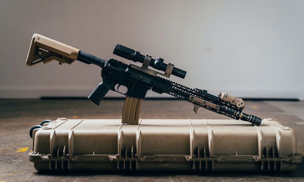assault-style rifle: assault-style rifle sitting on case