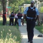 Police in Chicago, where homicides have soared recently, as they investigated a fatal shooting in May 2014 of a man in the 5700 block of South LaSalle Street.