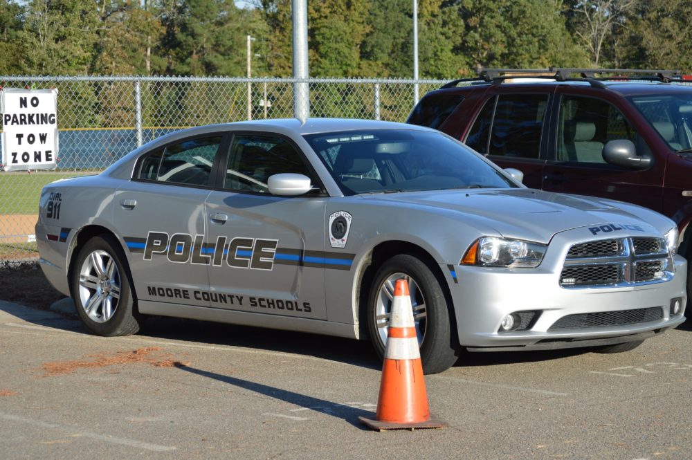 A school district added its name to police car for officers assigned to its schools,
