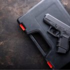 California gun owners living with youth study: Pistol, Gun over case for gun on dark metal table