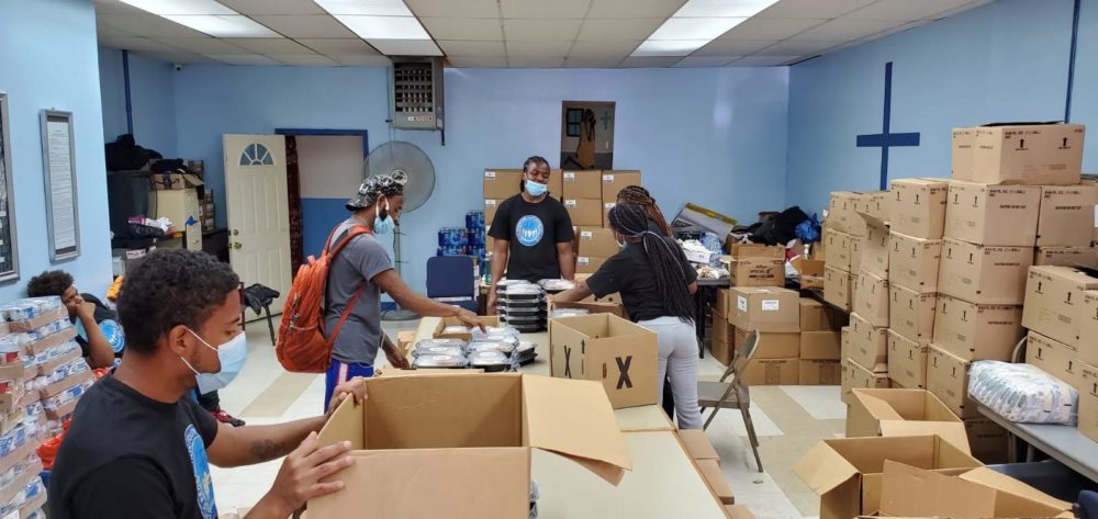 Living Redemption Youth Opportunity Hub youth, including those in the juvenile justice system, boxed up food donations to distribute in in their Harlem neighborhood.