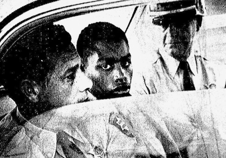 Henry Montgomery freed: old black and white photo of Montgomery in back of police car at his arrest in 1964