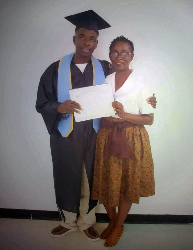 prisoners want more college prison programs: young black man stands with older black woman holding diploma