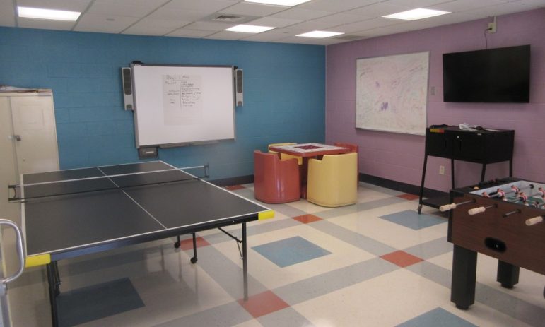 Connecticut turnaround of juvenile system sets standard: room with ping pong table and other games with colorful floor
