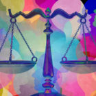 Justice: Scales of justice in front of multi-colored illustration of overlapping profiles of people.